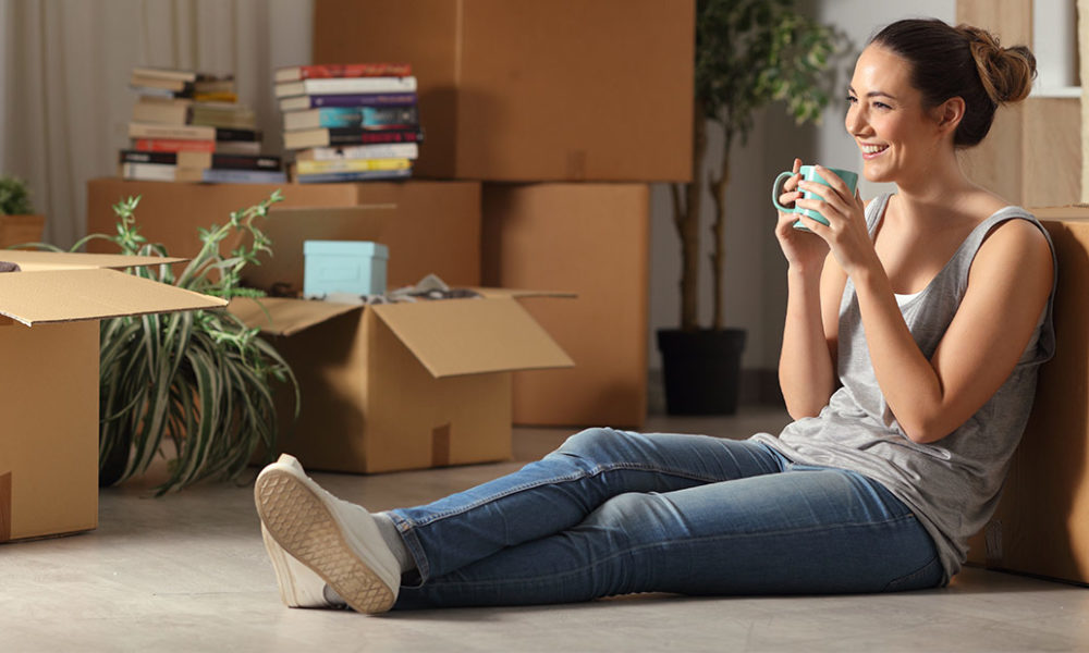 young woman in an apartment she's renting