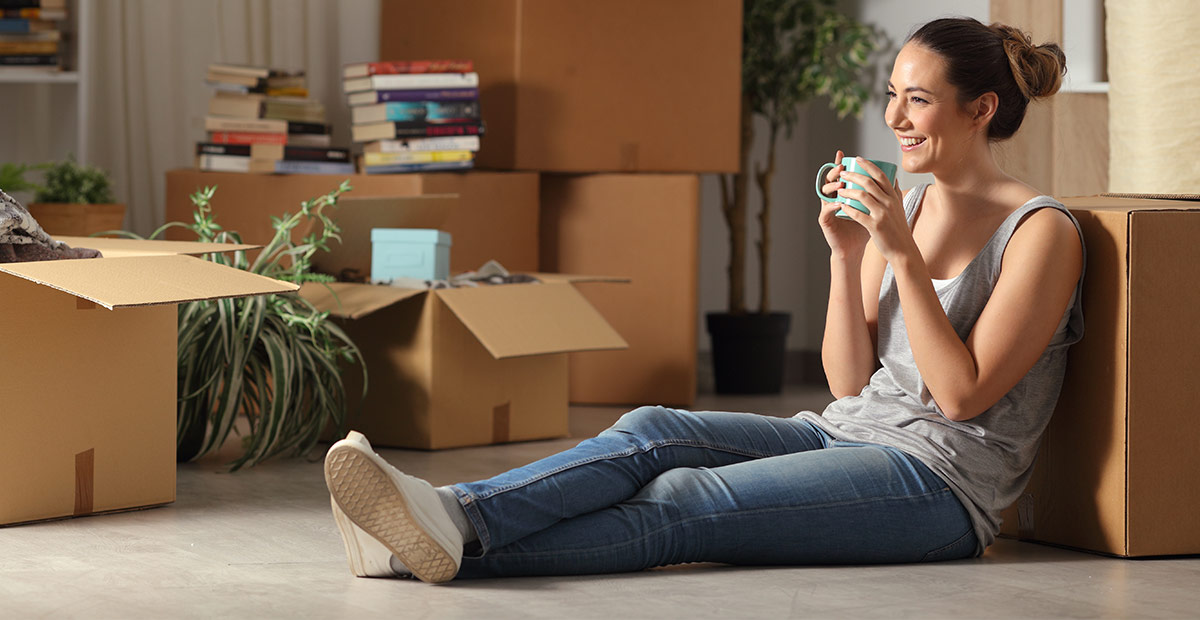 young woman in an apartment she's renting